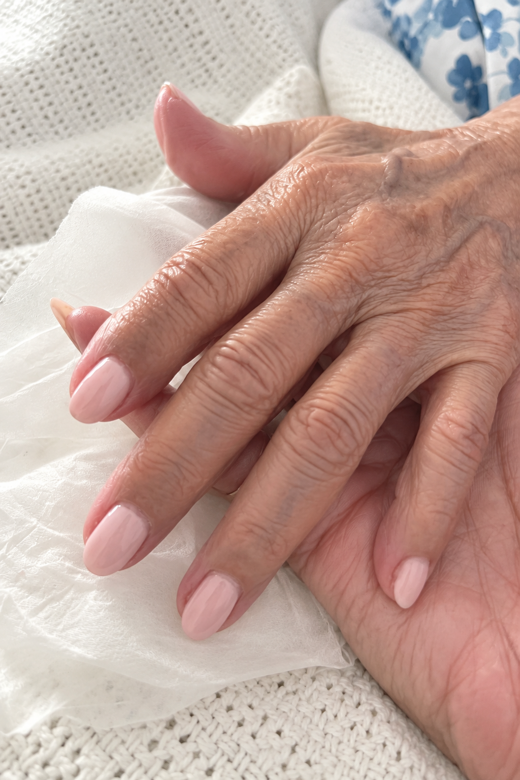 Nona’s hands resting gently together
